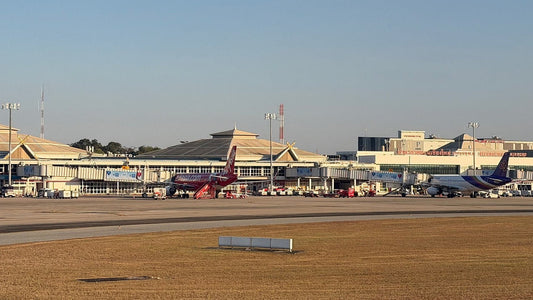 Chiang Mai International Airport terminal with Lanna-style roofs and planes at the gates