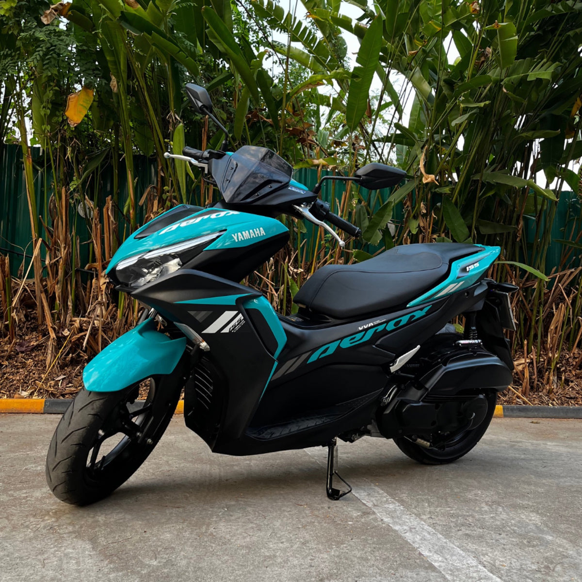 Fleet CNX Yamaha Aerox 155 among banana leaves